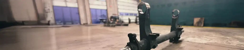 Hendrickson suspension being serviced in a shop.