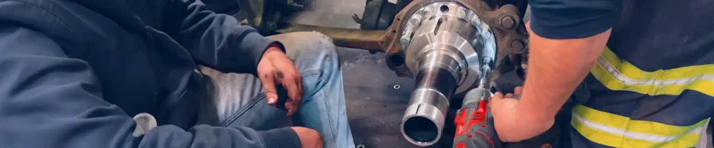 Technicians replacing a spindle