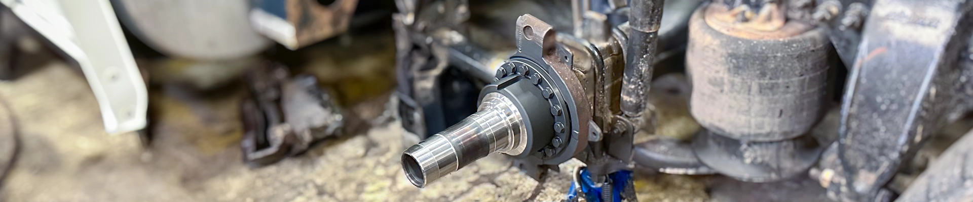 A shiny new axle spindle freshly installed.